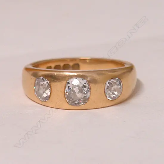 A good 19thC lady's estate 18ct. rose gold and three diamond gypsy style ring