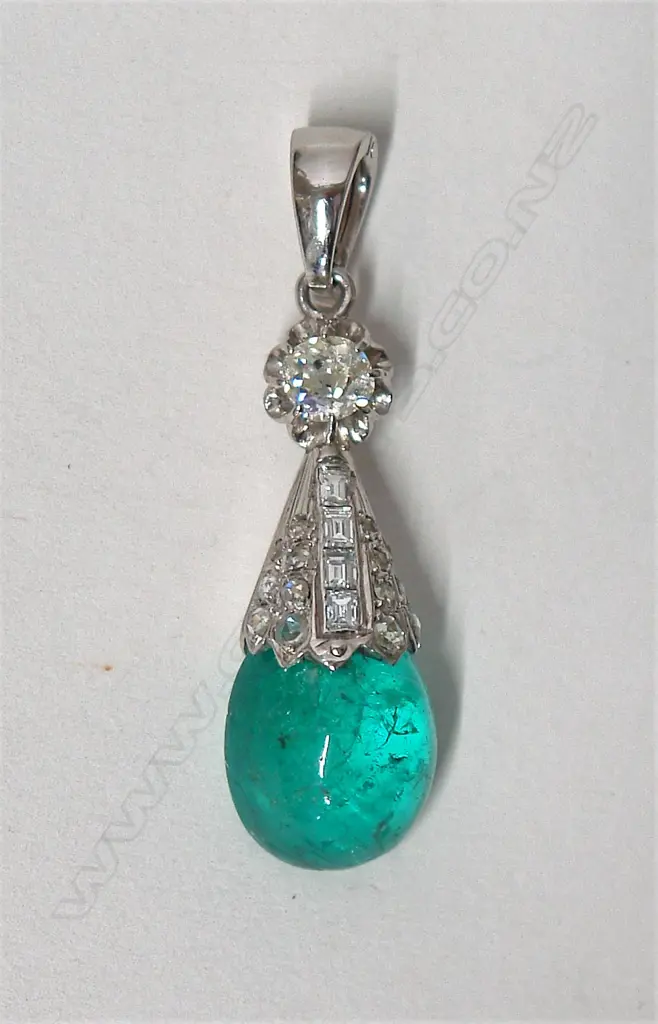 A 9ct. and 14ct. white gold emerald and estate diamond pendant Image 1++