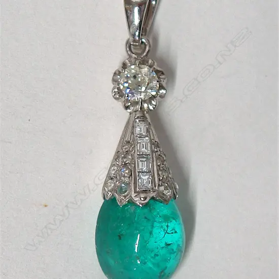 A 9ct. and 14ct. white gold emerald and estate diamond pendant