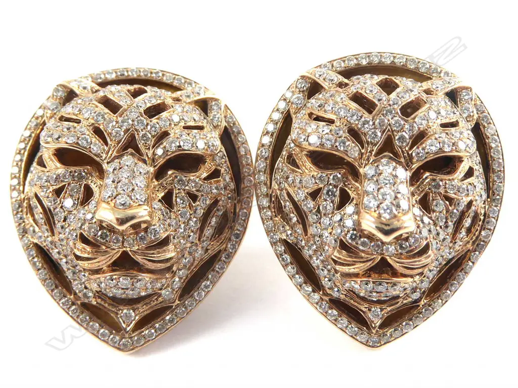 A pair of 18ct rose gold and diamond earrings Image 1++