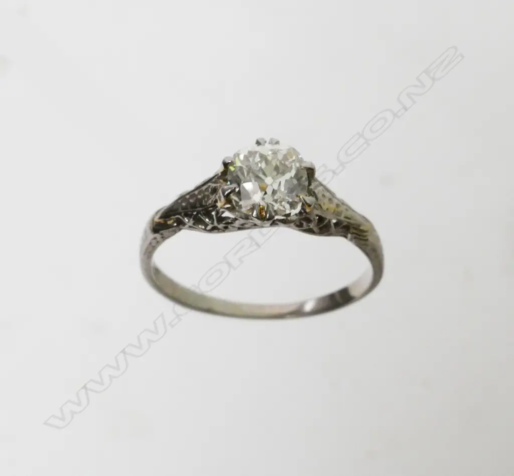 An estate 18ct white gold and diamond solitaire ring Image 1++