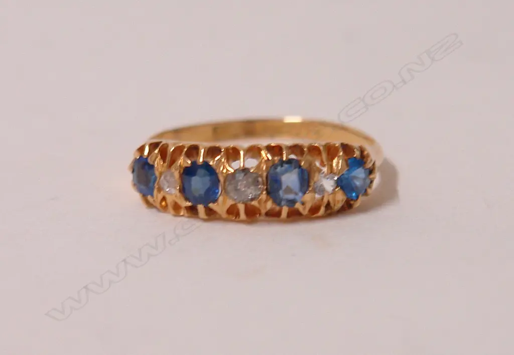 A late Victorian 18ct. yellow gold sapphire and diamond bridge ring Image 1++
