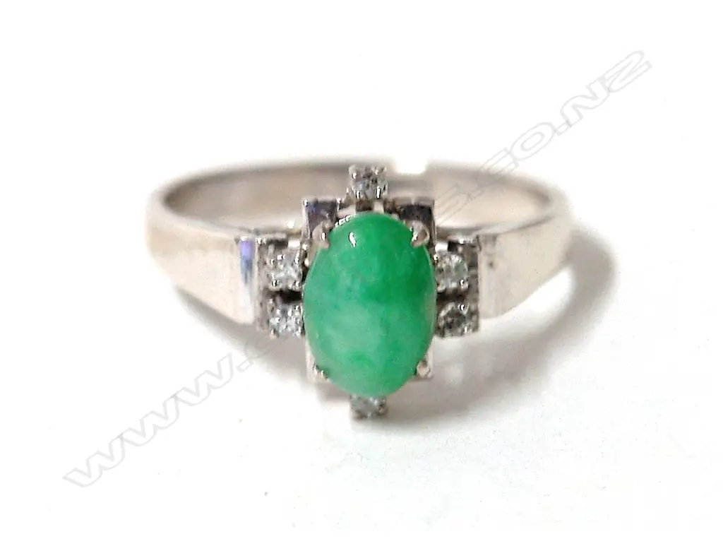 A lady's 18ct. white gold Chinese jade and diamond dress ring Image 1++