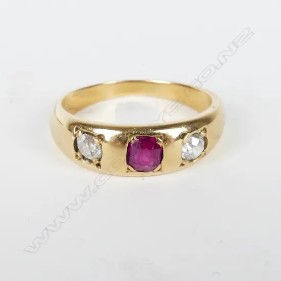 An estate 18ct. gold diamond and ruby ring
