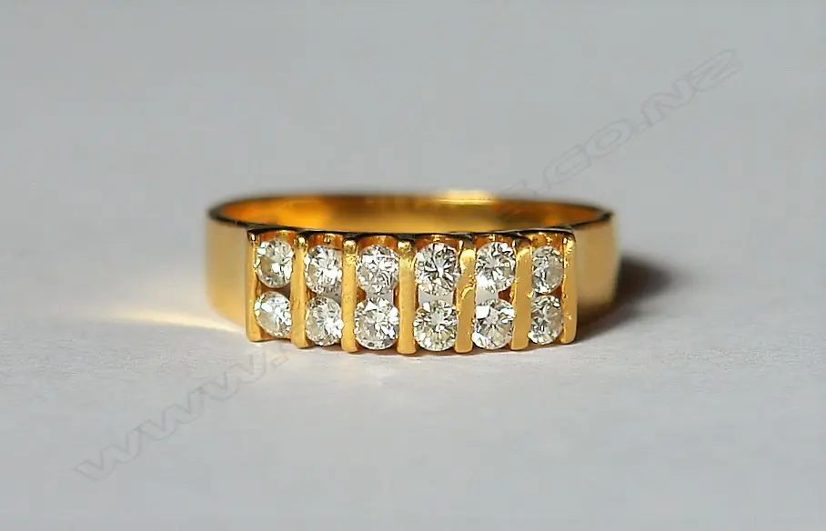 An 18ct. yellow gold and multi-diamond ring Image 1++