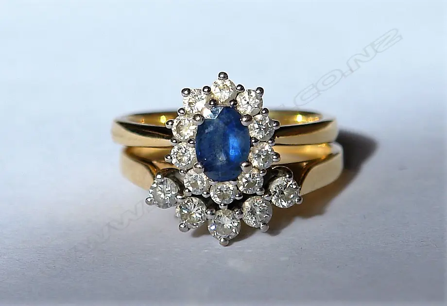 A pair of 18ct. white gold sapphire and diamond rings Image 1++