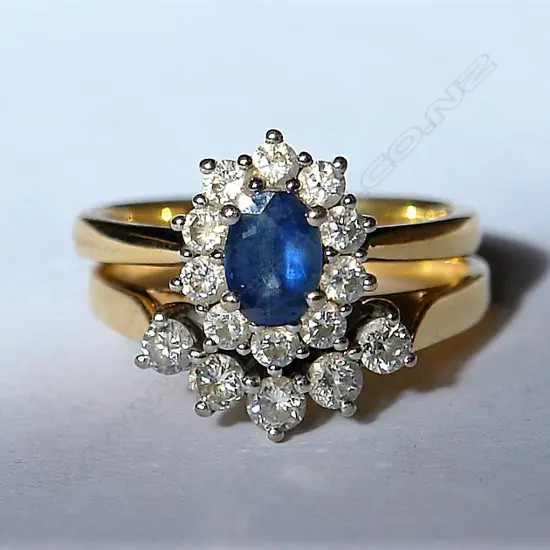 A pair of 18ct. white gold sapphire and diamond rings