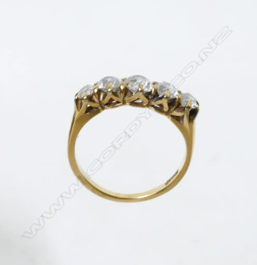 An estate 18ct. gold and five stone diamond ring Image 1++