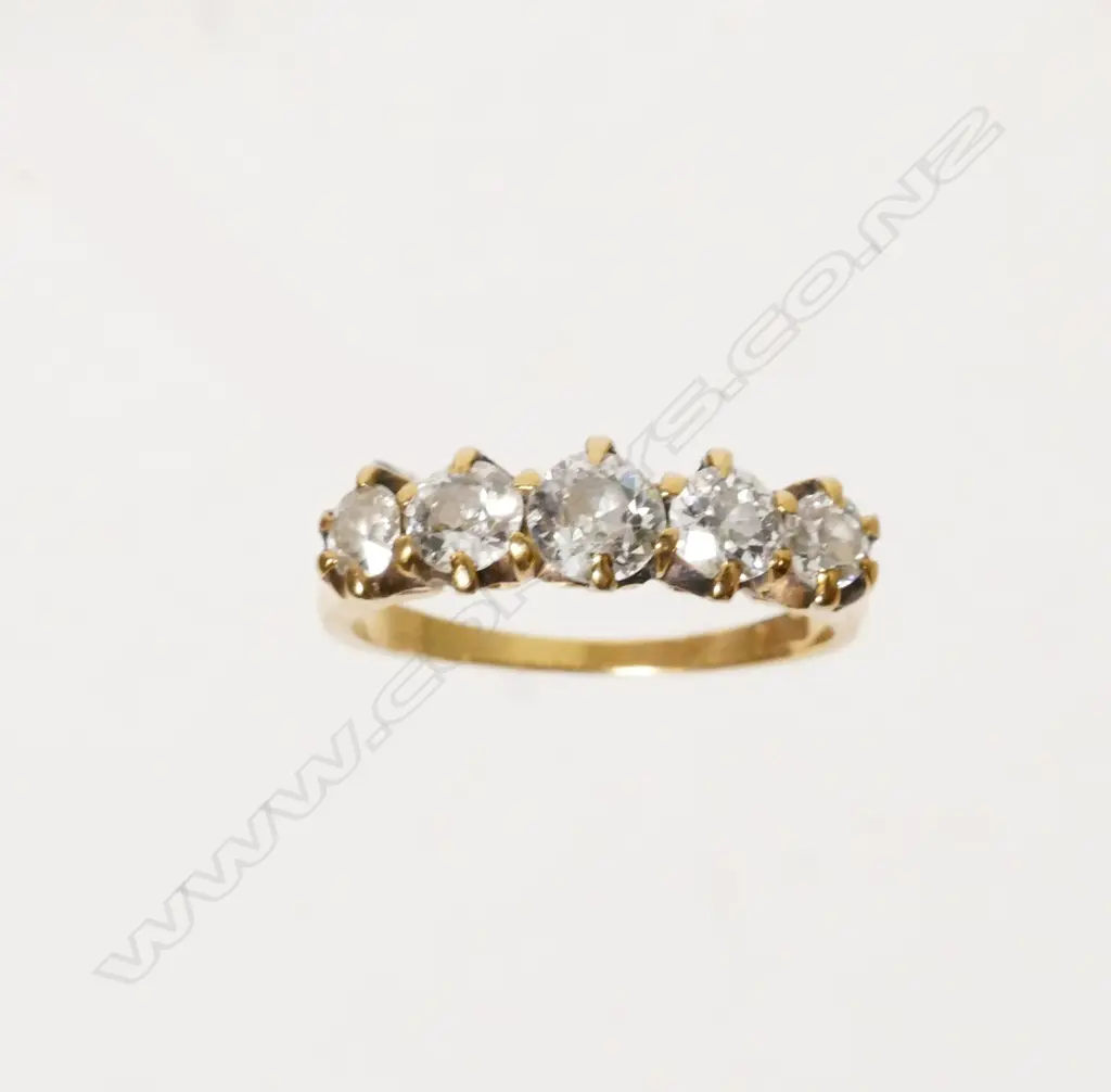 An estate 18ct. gold and five stone diamond ring Image 1++