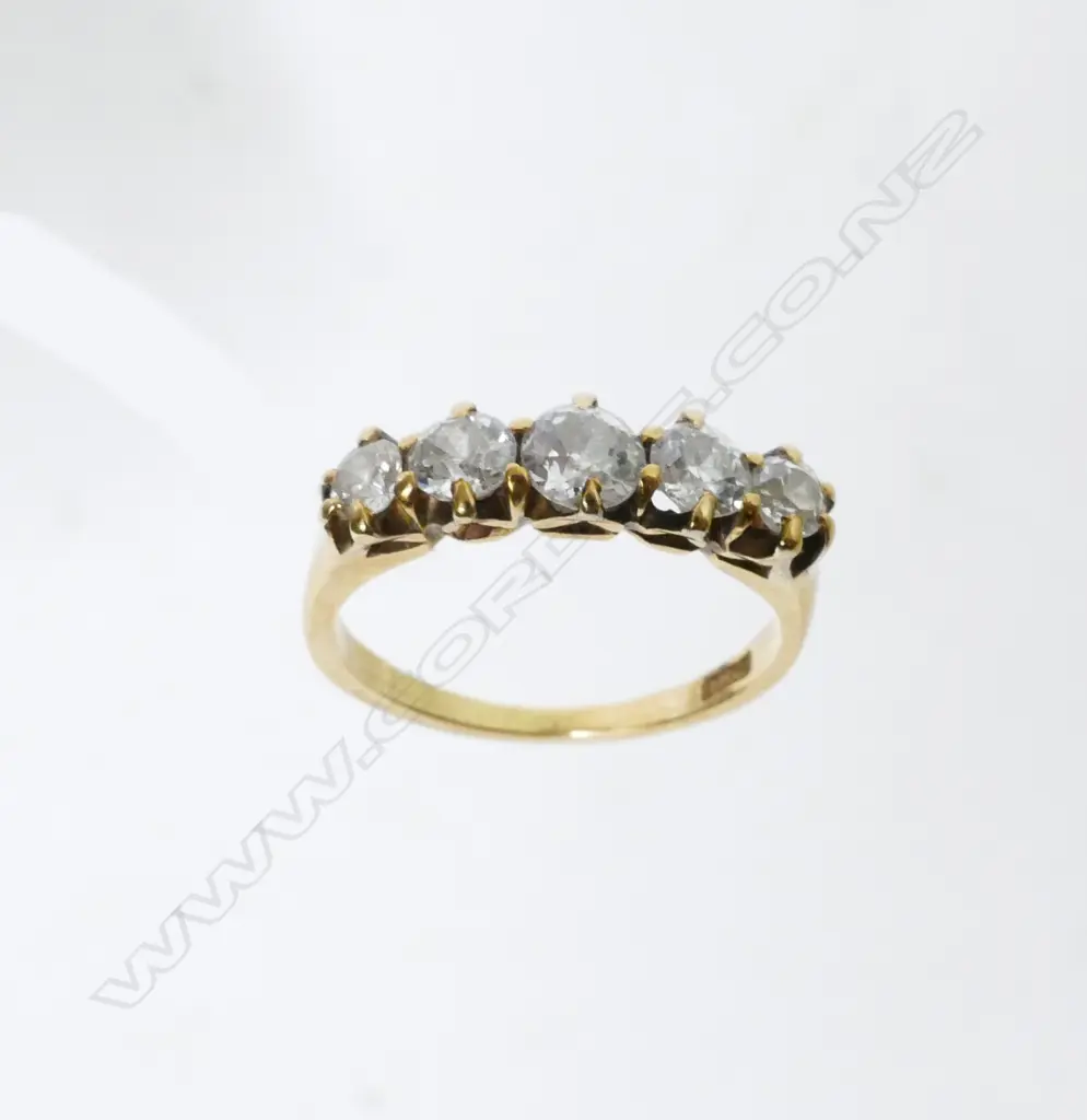 An estate 18ct. gold and five stone diamond ring Image 1++