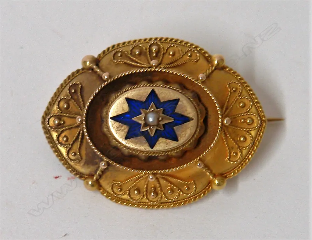A Victorian 15ct. yellow gold enamel and pearl Etruscan brooch Image 1++