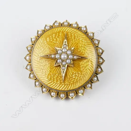 An Edwardian 9ct. gold enamel and pearl photo brooch