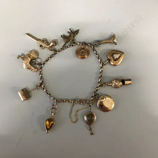 An antique 9ct gold charm bracelet