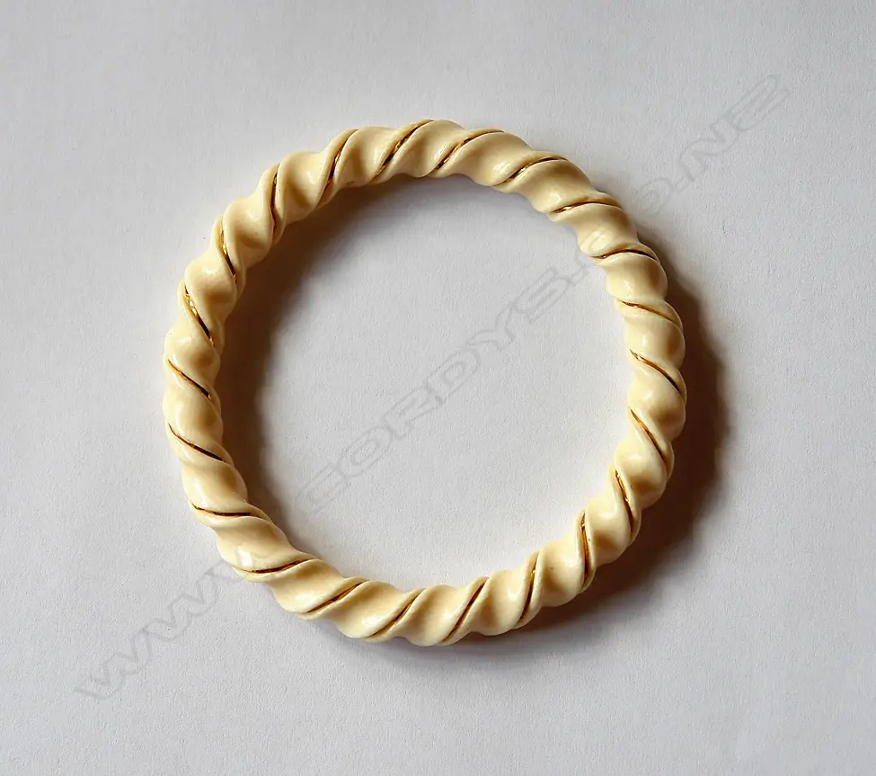 A spiral carved ivory bangle with gold wire highlight Image 1++
