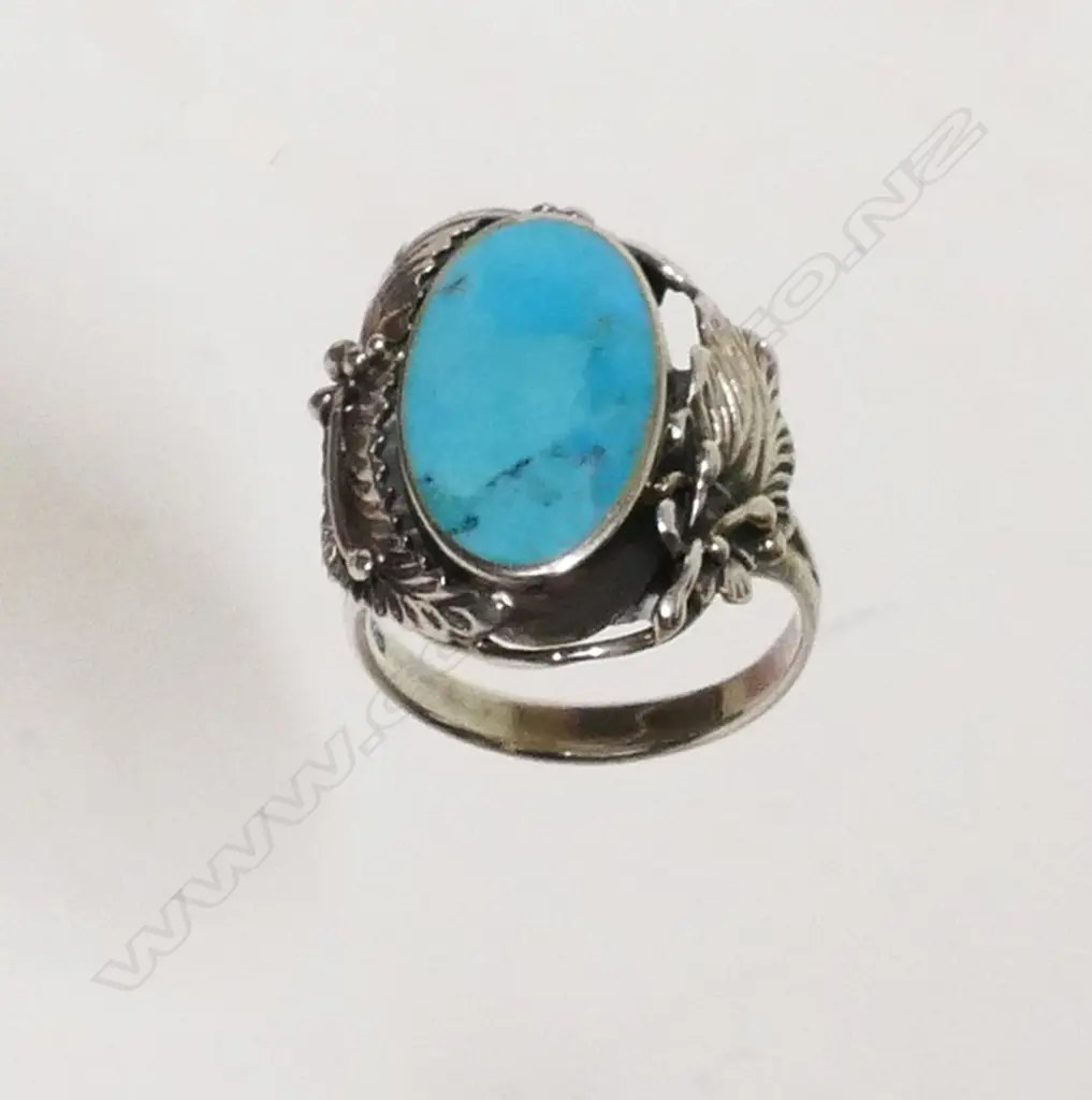 A Navajo silver and turquoise ring Image 1++
