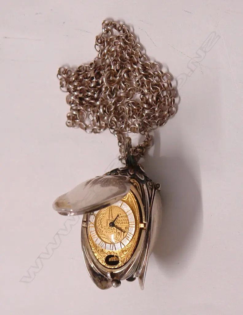 A silver pendant watch Image 1++