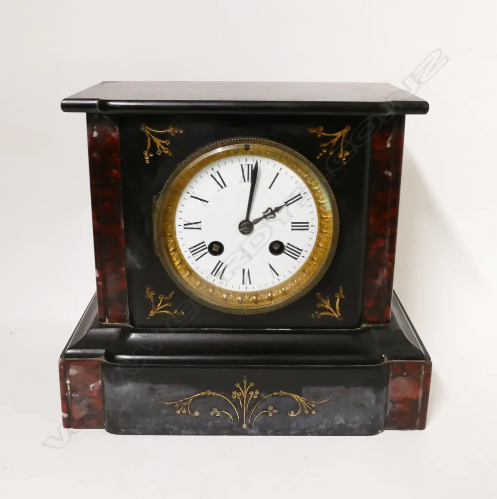 A Victorian black slate cased mantel clock Image 1++