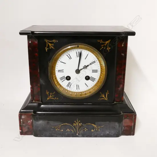 A Victorian black slate cased mantel clock