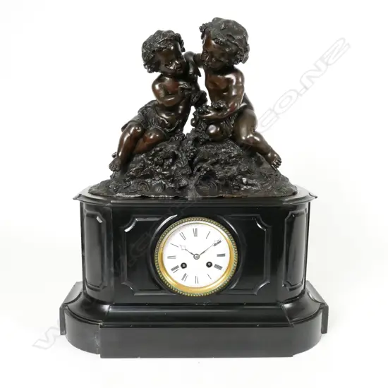 A Victorian black marble cased mantel clock