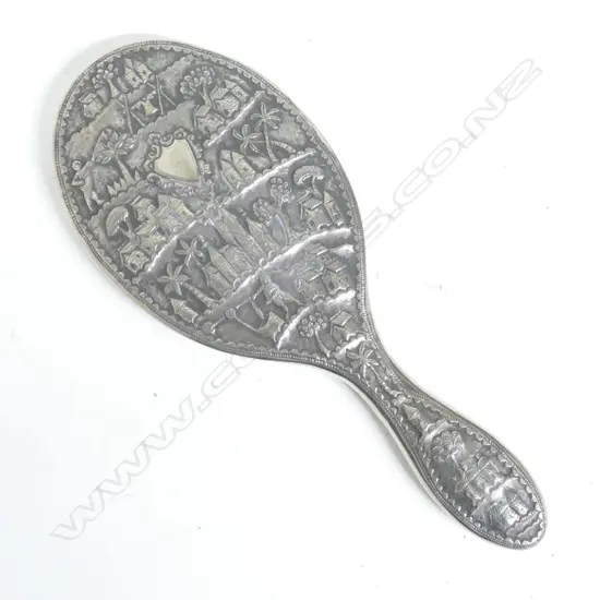 An unusual late 19thC Indian silver dressing table hand mirror