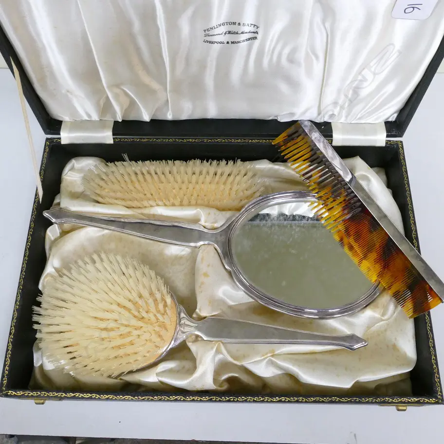 A three-piece silver dressing table set Image 1++
