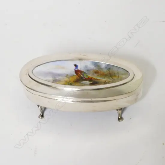 A silver lidded trinket box