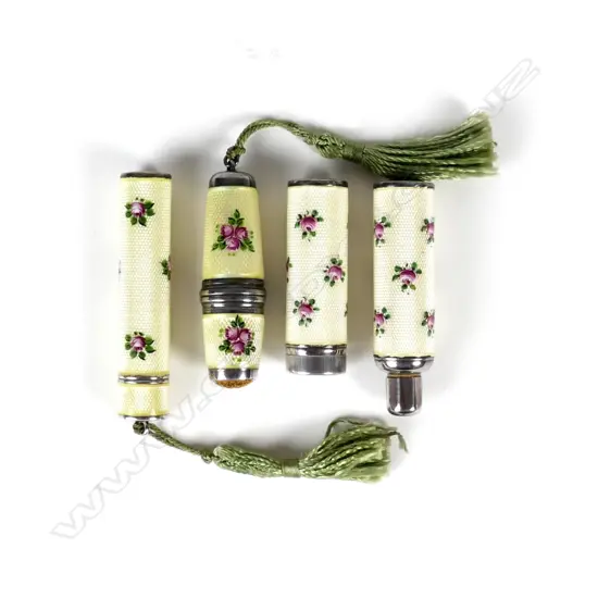 A small silver and enamel travelling set