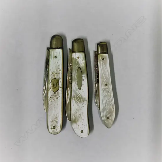 Three silver and mother-of-pearl folding fruit knives