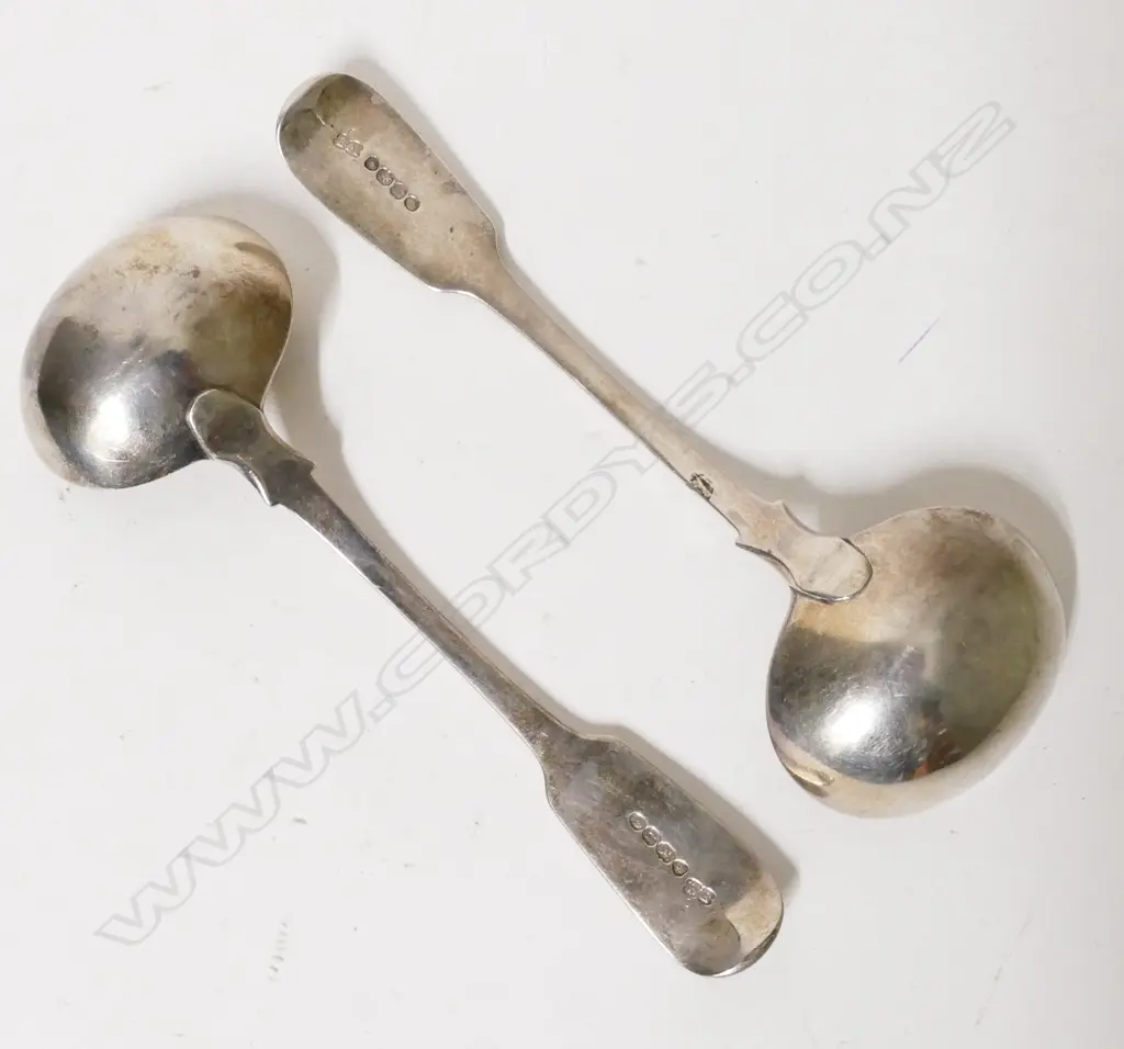 A pair of heavy William IV fiddle pattern silver sauce ladles Image 1++