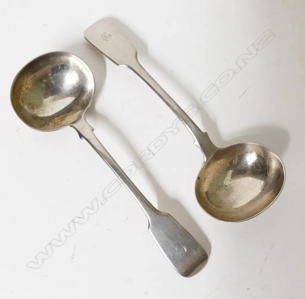 A pair of heavy William IV fiddle pattern silver sauce ladles Image 1++