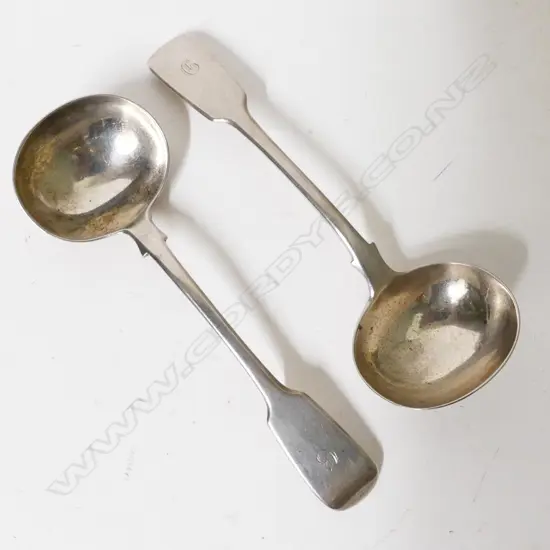 A pair of heavy William IV fiddle pattern silver sauce ladles