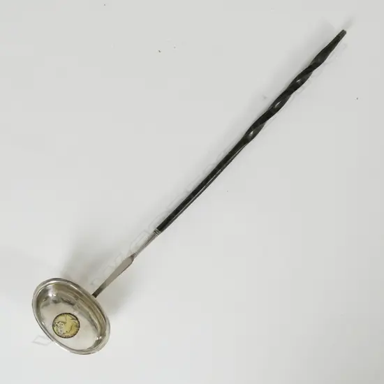 An 18thC embossed silver toddy ladle