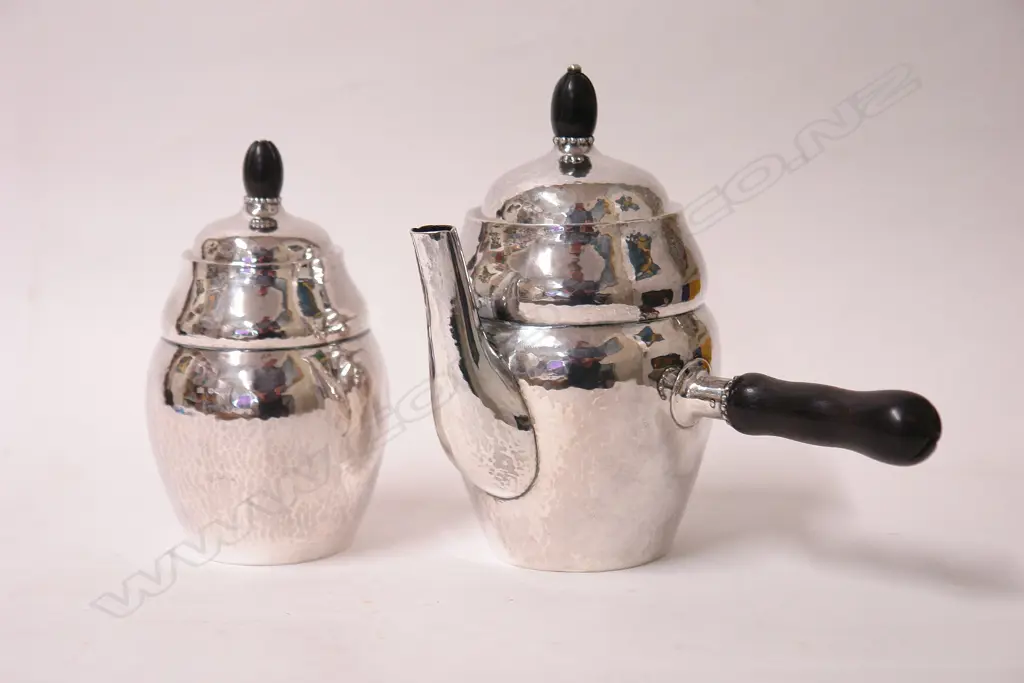 A Georg Jensen 1922 silver coffee pot and lidded sugar bowl Image 1++