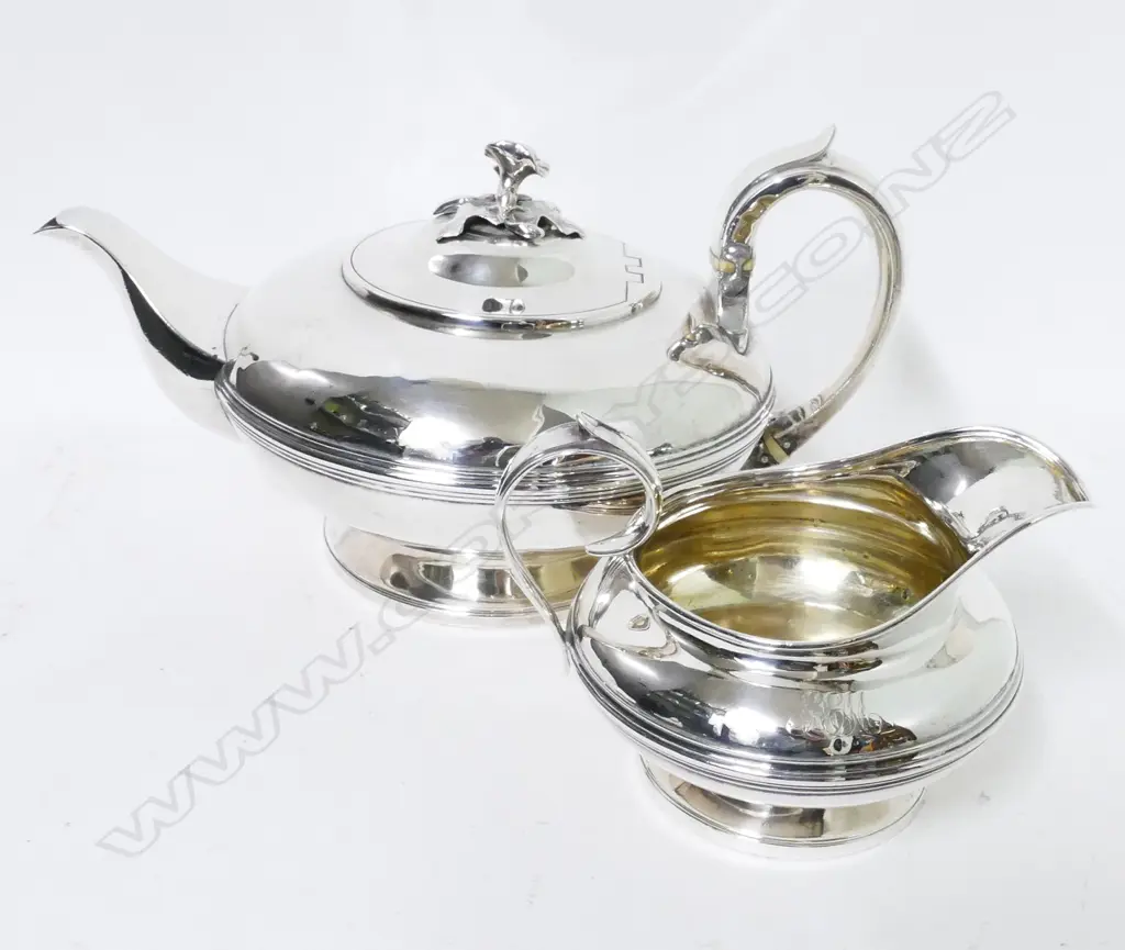 A William IV circular silver teapot and matching cream jug Image 1++