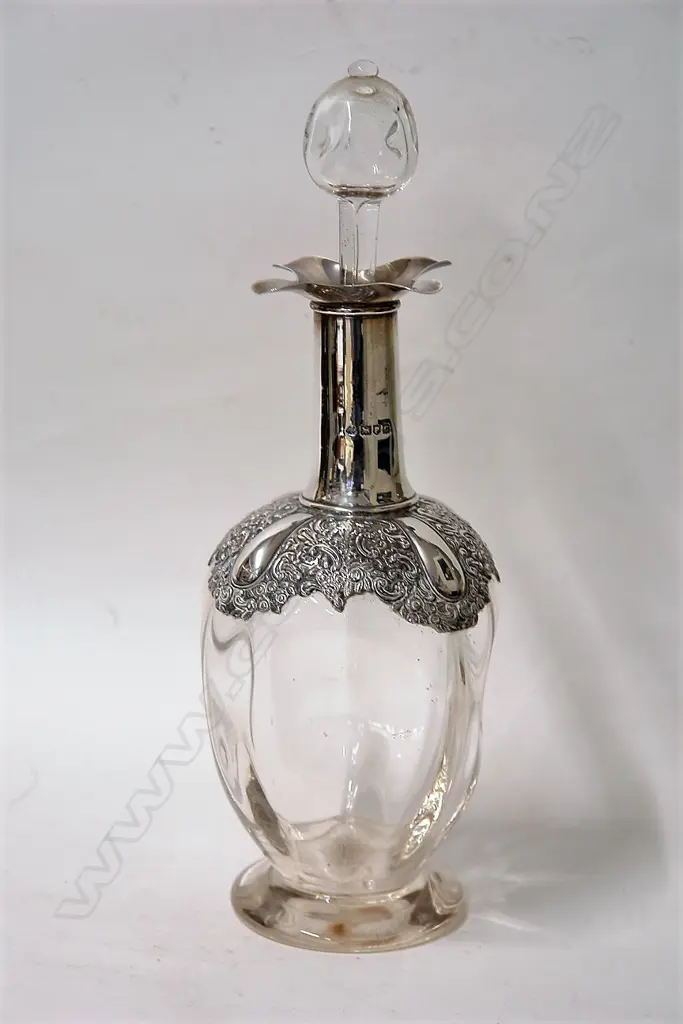 A late Victorian silver mounted dimpled glass decanter Image 1++
