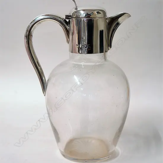 A late Victorian silver mounted glass claret jug