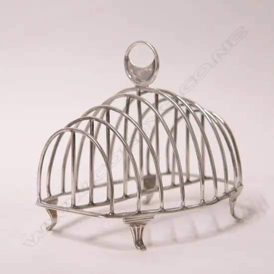 A George III silver eight-slice toast rack