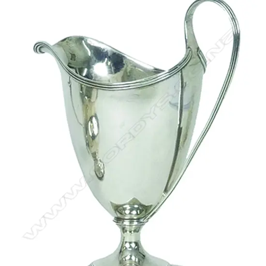 A George III silver helmet shaped cream jug