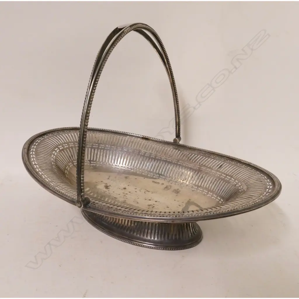 A heavy Georgian Revival silver cake basket Image 1++