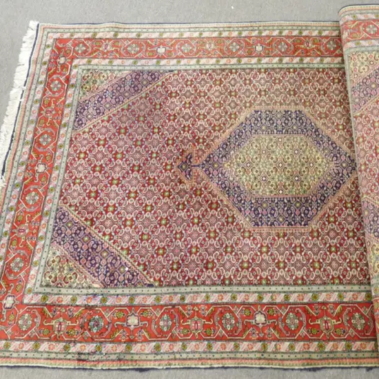 A large hand knotted Ardabil rug