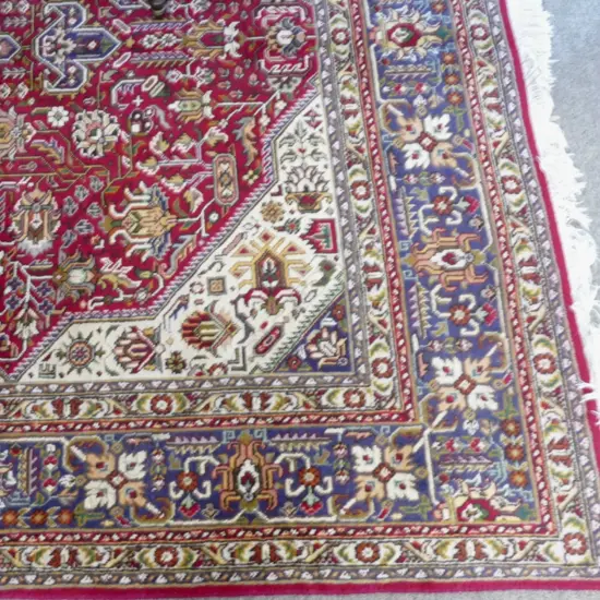A hand knotted Persian Tabriz carpet