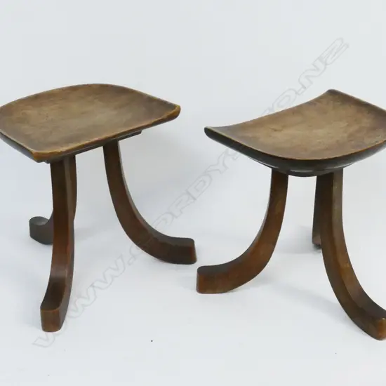 A pair of Egyptian Revival 'Thebes' three-legged stools
