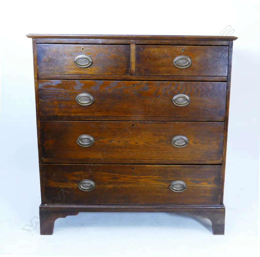 An oak five drawer flat-front chest Image 1++