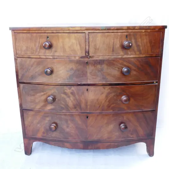 A Georgian mahogany bow front chest of drawers