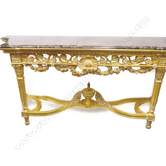 An ornate French style giltwood and marble console table