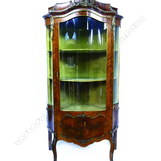 A Louis XVI style kingwood bowfront vitrine