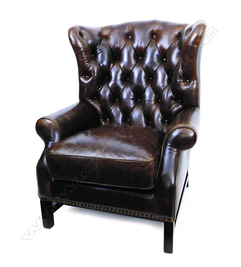 A good modern dark brown buttoned leather wingback armchair Image 1++