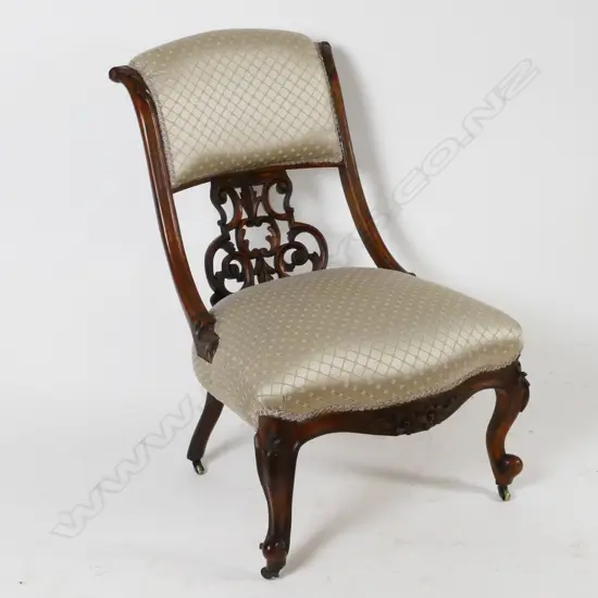 A Victorian carved walnut parlour chair