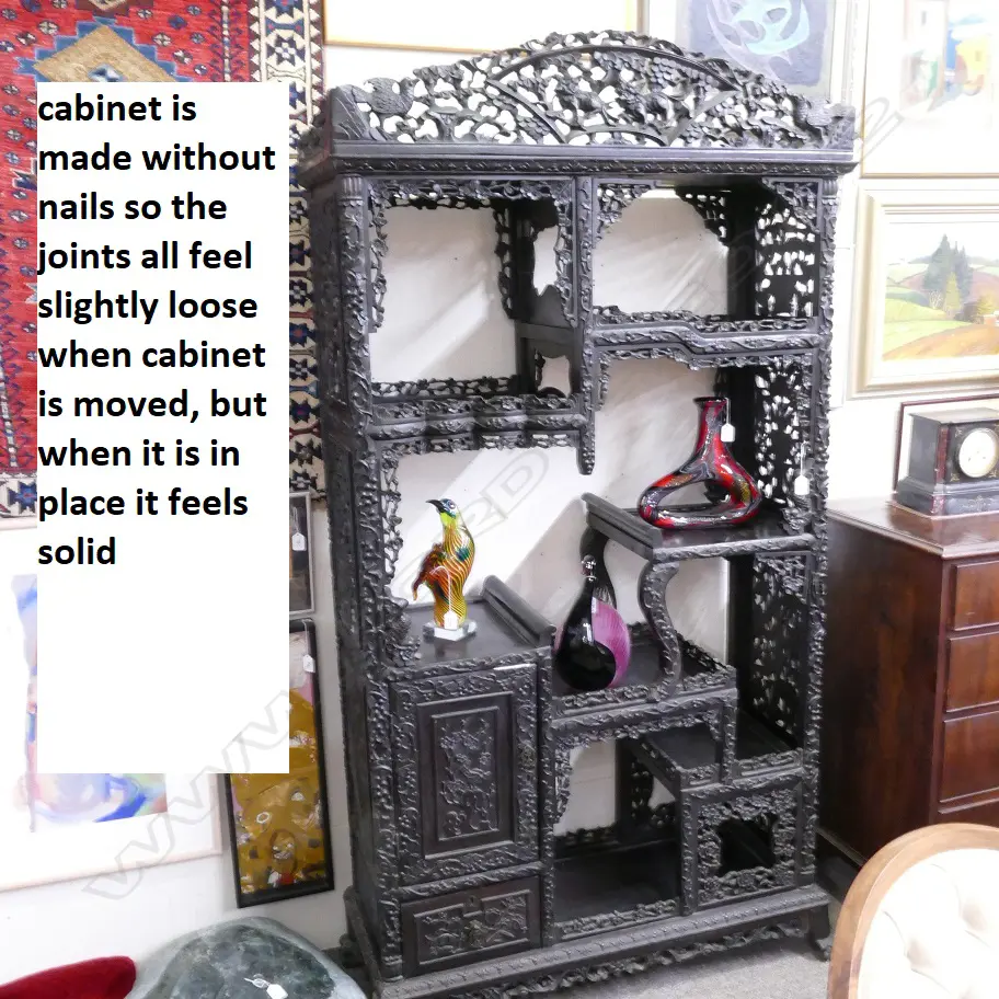 An ornate Chinese blackwood carved display cabinet Image 1++