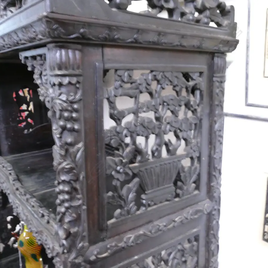 An ornate Chinese blackwood carved display cabinet Image 1++